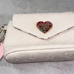 Juicy Couture  Elegant Cream Wristlet with Heart Accent Photo 4