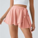 Halara  Skirt High Waisted Breezeful Tie Side 2in1 Side Pocket Mini Peach XS NWT Photo 1