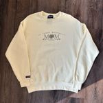 Jansport St.John’s Mom Yellow Sweatshirt Photo 0