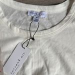 Anthropologie NEWAnthropologie current air contrast puff sleeves tie top white Medium Photo 6