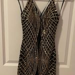 Windsor Black And Gold Sequined Homecoming Dress Photo 0