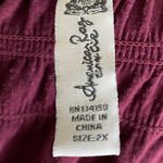 American Rag Maroon color top, babydoll style with smocked top and back, 3/4 sleeves, excellent condition, size 2x Measurements: Bust: armpit to armpit 22-28 inches Length: shoulder seam to bottom 30 inches Photo 6