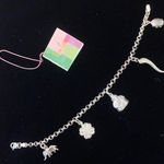 Sterling silver and peridot lucky charm bracelet. Photo 0