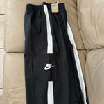 Nike Women's Sportswear Repel Essential Woven Jogger Pants Photo 13