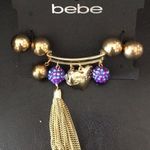 Bebe New  Gold, purple balls & tassel bracelet Photo 0