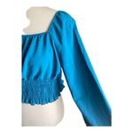 SheIn NWOT--BLUE/GREEN LONG SLEEVE CROP TOP-SIZE LARGE Beautiful crop top, color is a blue green color, puff long sleeves, smocked bottom, 80% polyester and 29% cotton, excellent condition, size large Measurements: Bust: armpit to armpit 19-20 inches Length: shoulder seam to bottom 17 inches Photo 3