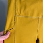 Athleta  Ultimate‎ Stash pocket mustard yellow size XXS like new 7/8 length Photo 1