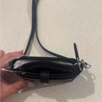 DKNY Black Crossbody Bag with Monogram Pattern and Adjustable Strap Photo 1