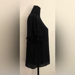 Ann Taylor - Black ruffled shoulders‎ short sleeve blouse 
Size M Photo 1