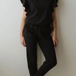 Albion Fit Nine To Nine Ruffle Sleeve Jumpsuit black size medium Photo 1