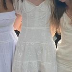 Isabelle's Cabinet White Eyelet Mini Dress from  - Tie-back, puff sleeves, summer Photo 0