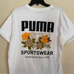 sports wear women’s short sleeve size large with floral puma back design Photo 3