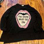 Crown & Ivy Women’s oversized Cabana by  black long-sleeve sweater with a pink lip and star graphic and "The Show Must Go On". Size small  Photo 0
