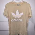 Adidas  pastel yellow t shirt Photo 1