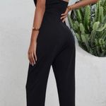 black front open cut jumpsuit open halter back Size M Photo 1