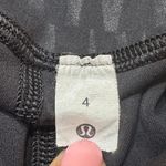 Lululemon  Leggings sz 4 Black Print Cropped Length Leggings Photo 6