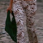 Indah  Brown and White Patterned Flare Pants Photo 0