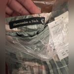 Abercrombie & Fitch co-ord tiered floral print satin maxi skirt in green Photo 7