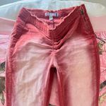 Urban Outfitters y2k burgundy light stone washed flare low waisted jeans Photo 4