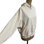 We Wore What  cream hooded sweatshirt with front pocket size Medium Photo 1