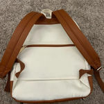 White and brown backpack Photo 1