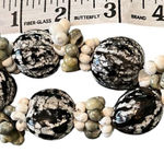 Pods & sea shells adorn this pretty black green & cream bracelet EUC Photo 0