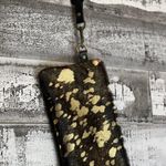 Metallic leather acid wash black/brown and gold wristlet with removable strap. Black Photo 2