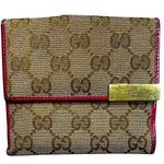 Gucci •  canvas and pink leather bifold wallet Photo 0