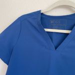 FIGS  Denim Blue Casma Three Pocket Scrub Top Photo 3