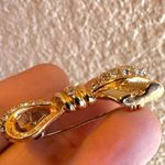 Roman gold tone rhinestone bow brooch Photo 3