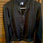 Divided - Black shiny long sleeved blouse with zipper front Photo 0