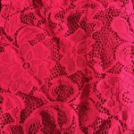 Free People jumpsuit. Red lace w/ deep V & shoulder detail. Color-red size small Photo 4