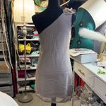 Los Angeles Apparel Asymmetrical dress in grey with cascading ruffles, perfect for elegant events. Photo 3