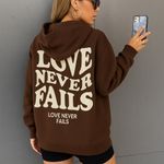 SheIn  Brown Hoodie with 'Love Never Fails' Graphic Photo 1