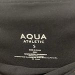 AQUA  black and gold animal print 7/8 leggings. Photo 7