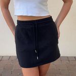 Black cotton mini skirt with elastic waist and tie Size M Photo 1