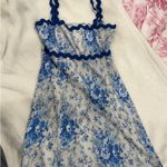 ASOS Blue and white floral mini dress with scalloped trim and blue straps Photo 1