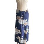 Blooming Jelly NWT--ASYMMETRICAL BLUE FLORAL AND WHITE LACE MAXI DRESS-SIZE XL Gorgeous white lace top with a blue floral flowy skirt, backwards with cross straps, skirt has elastic back with a side zipper, lining is a navy blue under skirt, 95% cotton and 5% spandex, dress is brand new with tags, size xl Measurements: Bust: armpit to armpit 18 inches  Waist: side to side 16-18 inches  Length: back of skirt-shoulder seam to bottom is 60 inches Photo 4