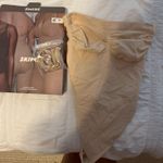 SKIMS  Seamless Sculpt Thong Bodysuit Photo 1