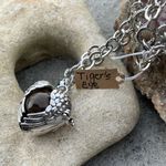 Boutique Tigers Eye stone in a heart shaped necklace cage. 36”chain Photo 6