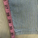 Levi's  524 Ultra Low Rise Skinny Leg Jeans with a blue and white striped pattern Photo 6