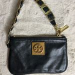 Tory Burch  Black and Gold Clutch with Leather Finish and Zipper Closure Photo 0