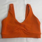 Vibrant Orange Seamless Sports Bra with Ruched Front Photo 0