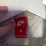 Nike The windbreaker large black light stain on back see picture Photo 2