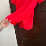 Trina Turk | Hot Coral Split Neck Drop Hem Short Sleeve Top Neon | Size Small Photo 3