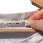 Kid kind women's XS white with blue faces sweatshirt, pit to pit 26", length 22" Photo 2