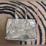 Clinique 🆕 Shimmering Silver Tote with Geometric Pouch Photo 3