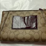 Coach  Brown Clutch with Monogram Pattern and Zipper Closure Photo 8