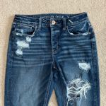 American Eagle  dark wash blue high rise distressed tomgirl button front jeans Photo 1