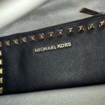 Michael Kors  Womens Saffiano Leather Stud Long Zip Clutch with gold tone studs. Photo 11